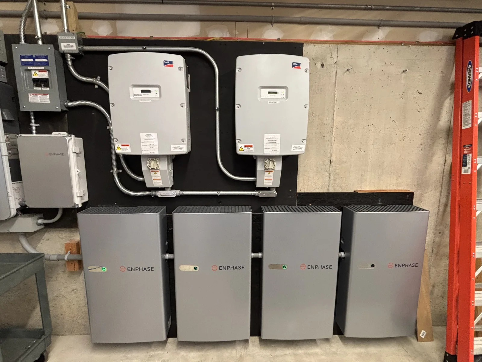 Indoor battery cabinets below inverter and electrical interconnection equipment