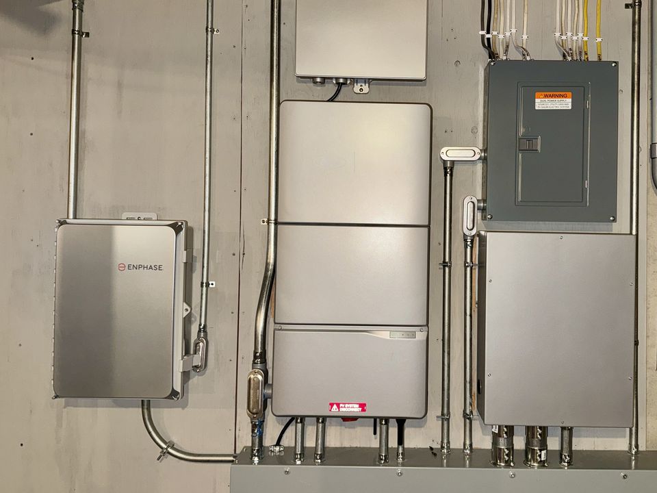 Ford home-energy integration equipment connected with residential electrical and Enphase solar equipment